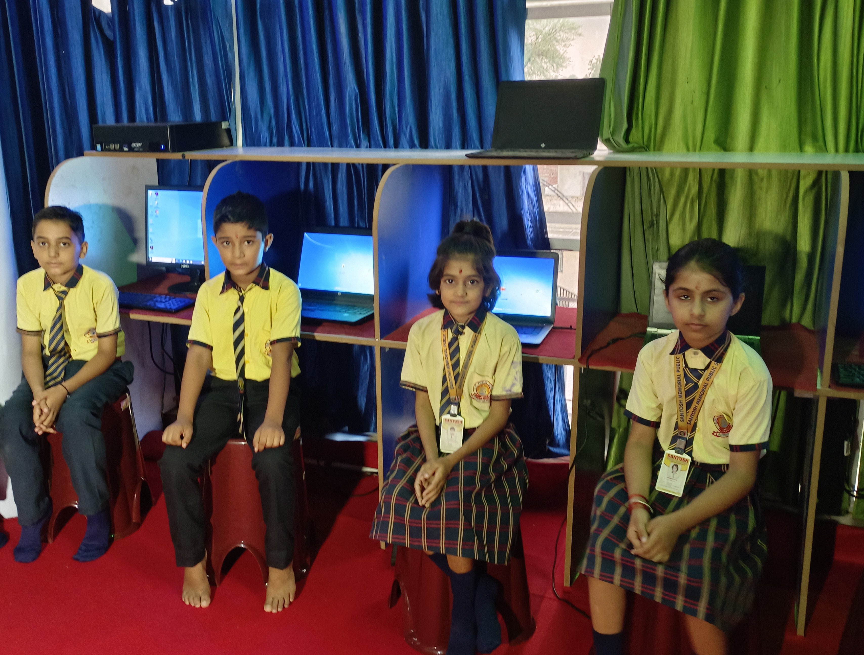 Students learning computer and technology skills at Santosh Memorial Public School